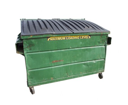 Company vehicle and skip on a roadside placement