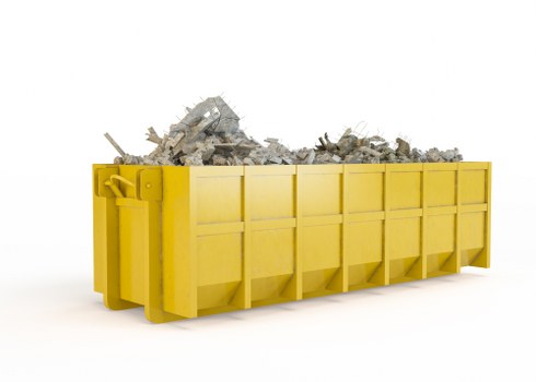 Workers managing construction debris