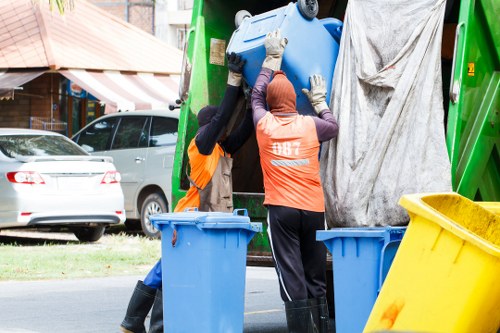 Workers segregating construction waste for recycling